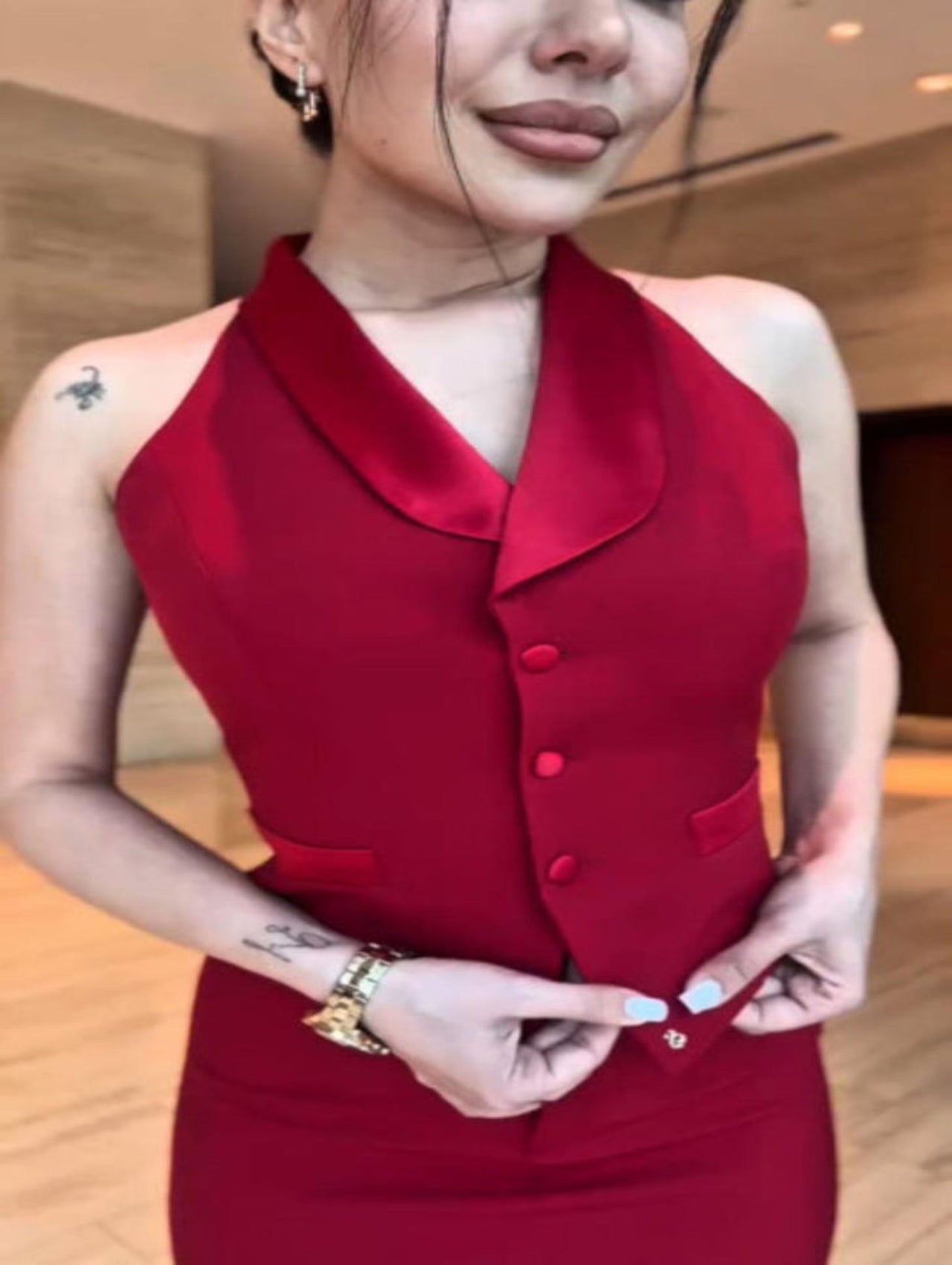 Person wearing a red dress with a blurred background